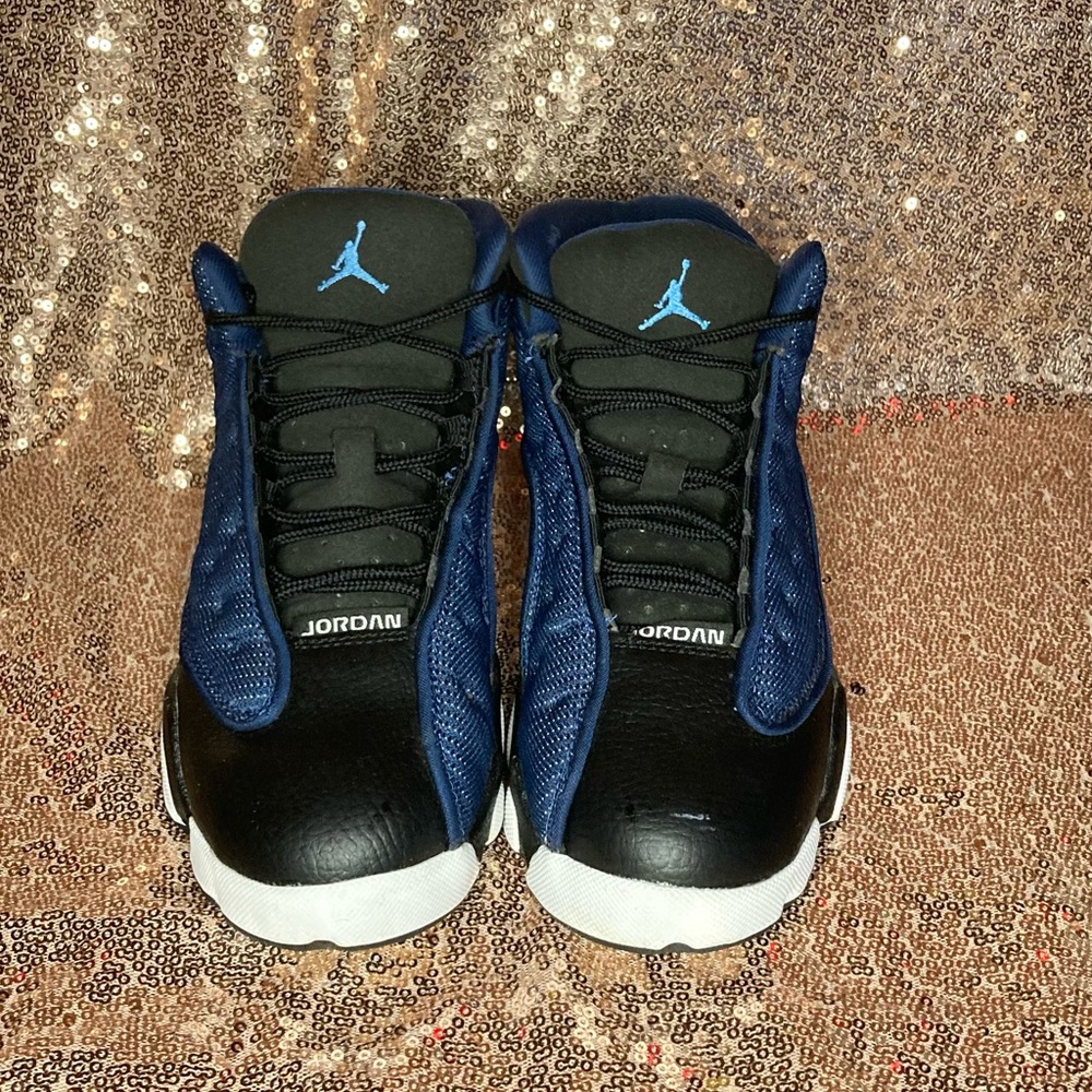 Kids navy and black jordan 13s
